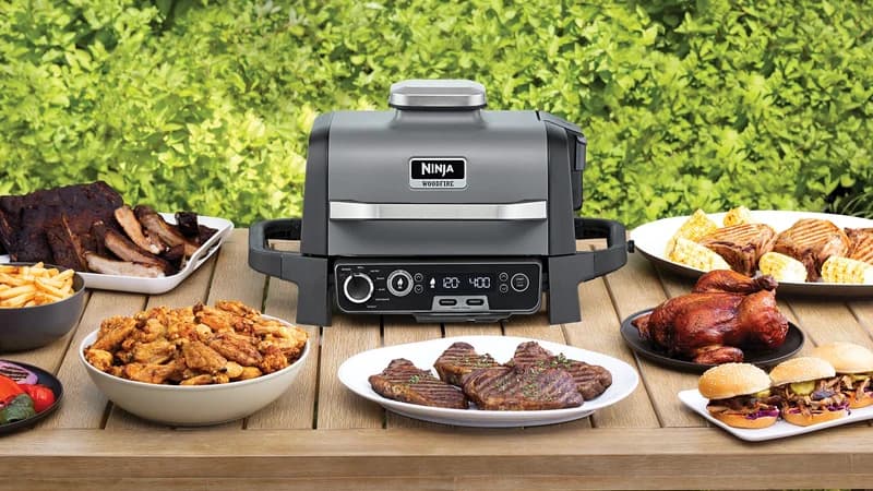 Ninja Woodfire grill loaded with food outdoors
